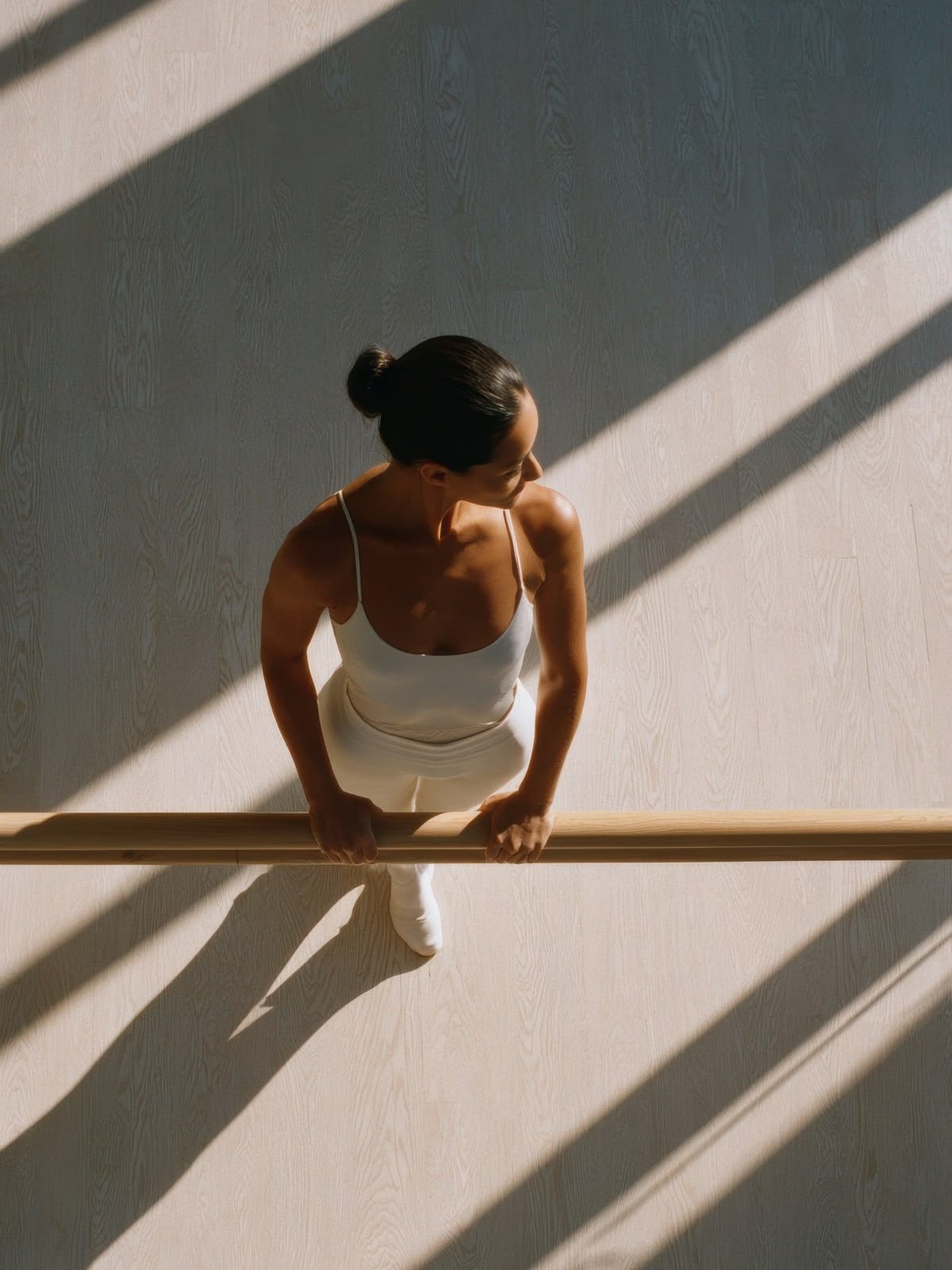 Dancer at the barre, overhead light