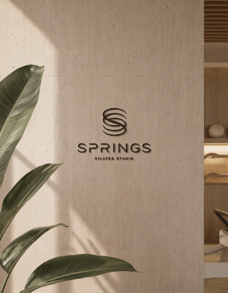 Springs Pilates Studio logo wall
